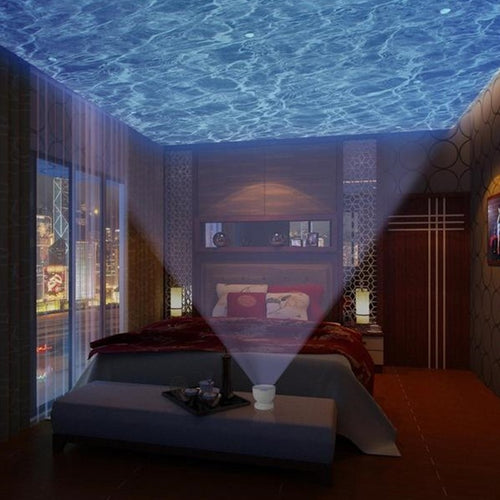 Projecteur aurore boréale projetant des vagues de lumière au plafond